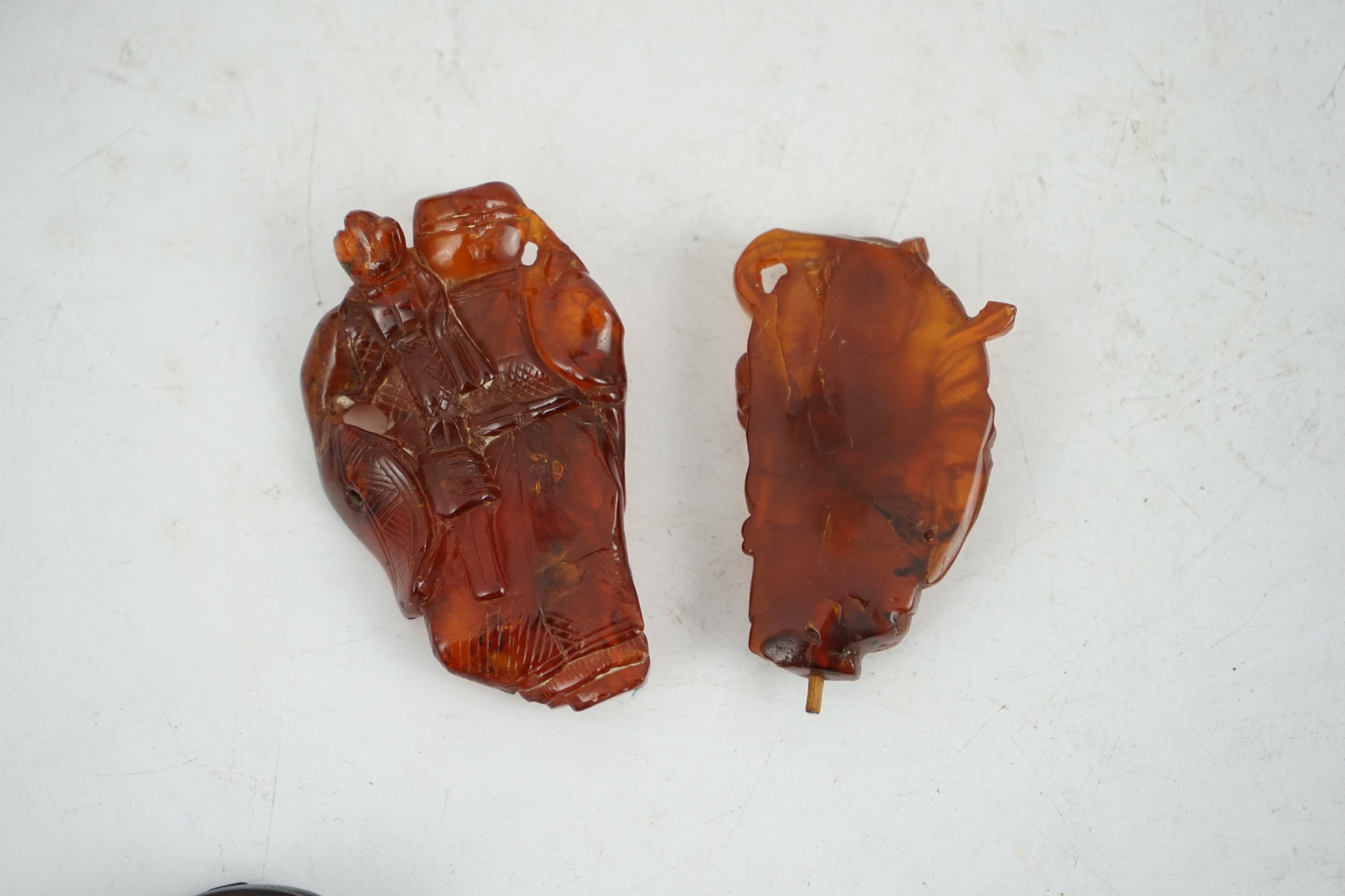 Three Chinese amber figures of immortals, 19th century